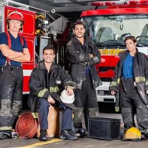 Group of firefighters together showing all the the features of what it is to be a firefighter.